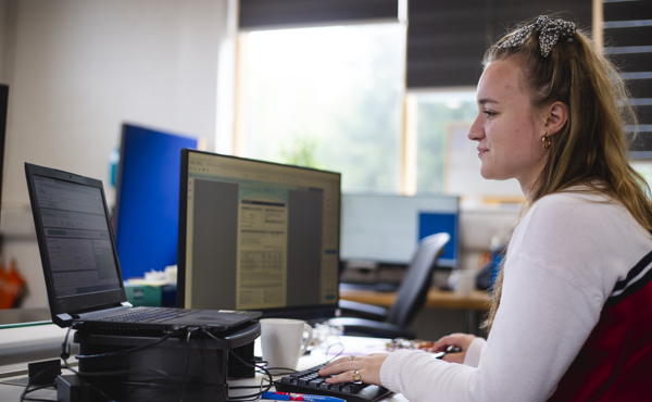 Woman at laptop working